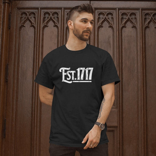 This T-Shirt design is a subtle nod to Freemasonry. Modern freemasonry was founded in the year 1717 in the Goose & Gridiron pub near St.Pauls, London. The graphic emblazoned on this quality T-shirt also has a faint masonic symbol in the background.